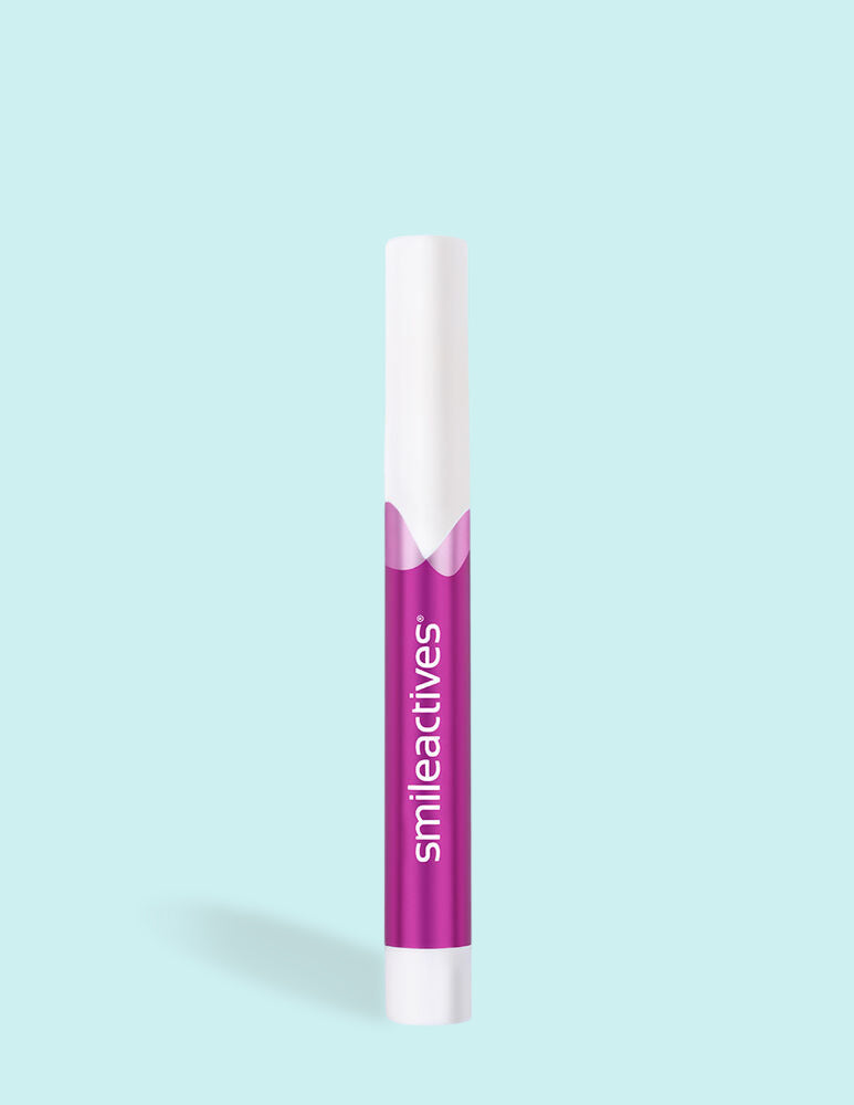 smileactives winterberry teeth whitening pen on a blue background