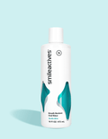 Bottle of smileactives breath restore oral rinse on a light blue background