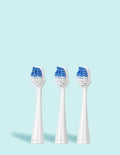 Three white electric toothbrush heads with blue bristle patterns on a light blue background