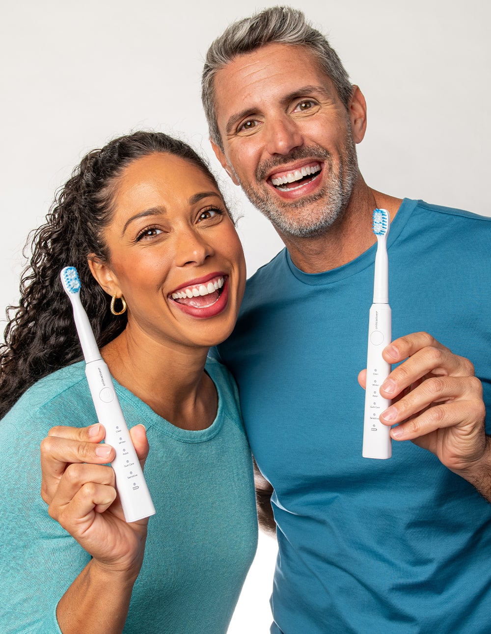 Model using the SmileActives Vibrite Blue LED Toothbrush